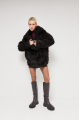 Double-sided curly sheepskin coat in dark chocolate color made of natural sheepskin in OVERSIZE style